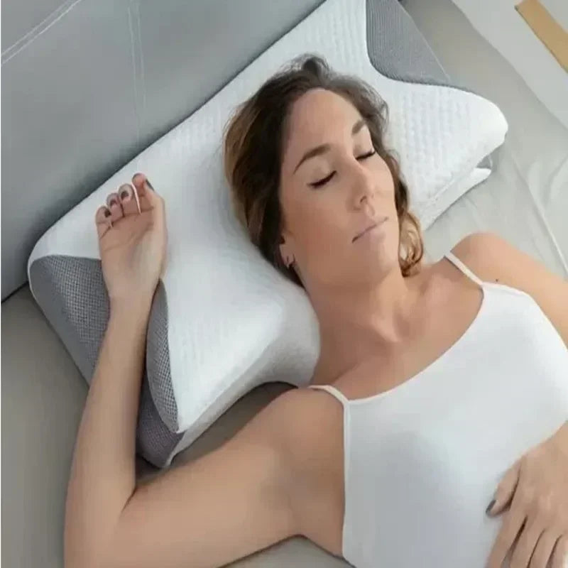 Memory foam pillow with anatomical contours for neck pain relief and abdominal support